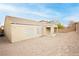 A rear exterior view of a home with a blank canvas backyard featuring a block wall and potential for landscaping at 187 Golden Crown Ave, Henderson, NV 89002