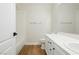 Bright bathroom with vanity, toilet, and shower-tub has wood-look floors at 187 Golden Crown Ave, Henderson, NV 89002