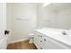 Bright bathroom with vanity, toilet, and shower-tub has wood-look floors at 187 Golden Crown Ave, Henderson, NV 89002