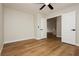 Bright bedroom with wood-style flooring and a double door access to the rest of the house at 187 Golden Crown Ave, Henderson, NV 89002