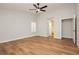 Spacious bedroom with wood-look flooring and shuttered windows, with an ensuite doorway at 187 Golden Crown Ave, Henderson, NV 89002
