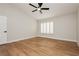 Spacious bedroom with wood-look flooring and shuttered windows, has ceiling fan at 187 Golden Crown Ave, Henderson, NV 89002