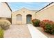 Inviting front entrance featuring a cozy archway, decorative gravel, and colorful shrubs for curb appeal at 187 Golden Crown Ave, Henderson, NV 89002