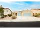Charming single-story home with well-kept landscaping and a spacious two-car garage at 187 Golden Crown Ave, Henderson, NV 89002
