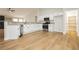 Bright kitchen features white cabinetry, stainless steel appliances, and a walk-in pantry at 187 Golden Crown Ave, Henderson, NV 89002