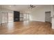 Bright living room boasts wood floors, fireplace and backyard access via sliding glass door at 187 Golden Crown Ave, Henderson, NV 89002