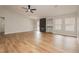 Spacious living room features wood-look flooring, a fireplace, and natural lighting at 187 Golden Crown Ave, Henderson, NV 89002