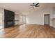 A spacious living room features new wood flooring, modern fireplace, high ceilings, and large windows at 187 Golden Crown Ave, Henderson, NV 89002