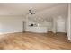 Open-concept living room with wood floors, high ceilings, and seamless transition to the kitchen and entry areas at 187 Golden Crown Ave, Henderson, NV 89002