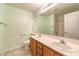 Well lit bathroom featuring a double sink vanity and tile flooring at 1970 Jasper Creek Pl, Las Vegas, NV 89123