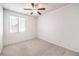 Neutral bedroom with carpet flooring, a ceiling fan, and window with blinds at 1970 Jasper Creek Pl, Las Vegas, NV 89123