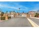Community entrance with secure gates and manicured landscaping, offering privacy and curb appeal at 1970 Jasper Creek Pl, Las Vegas, NV 89123