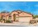 Charming single-story home with a well-manicured lawn and a two-car garage at 1970 Jasper Creek Pl, Las Vegas, NV 89123