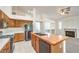 Bright kitchen featuring tile floors, butcher block island, and wood cabinetry at 1970 Jasper Creek Pl, Las Vegas, NV 89123