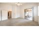 Bedroom featuring carpet flooring, a ceiling fan, and a sliding glass door to the backyard at 1970 Jasper Creek Pl, Las Vegas, NV 89123
