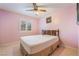 Bedroom with tile flooring, shuttered windows and bed at 213 Red Coral Dr, Henderson, NV 89002