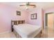 Cozy bedroom features a ceiling fan and light-filled windows at 213 Red Coral Dr, Henderson, NV 89002