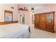 Bedroom with tile flooring and traditional wood furniture at 213 Red Coral Dr, Henderson, NV 89002