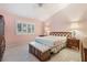 Bedroom with tile flooring, shuttered windows and traditional wood furniture at 213 Red Coral Dr, Henderson, NV 89002