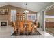 Dining area with tile floors, backyard access, fireplace, and natural light at 213 Red Coral Dr, Henderson, NV 89002
