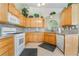 Traditional kitchen with granite countertops, tiled floors and oak cabinets at 213 Red Coral Dr, Henderson, NV 89002