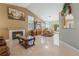 Open-concept living area with tile floors, fireplace, and views to the backyard at 213 Red Coral Dr, Henderson, NV 89002