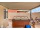 Relaxing outdoor patio featuring a rejuvenating hot tub and shaded area at 213 Red Coral Dr, Henderson, NV 89002