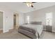 Inviting main bedroom featuring a plush bed, soft carpet, and ample natural light from multiple windows at 2271 Zephyr Ave, Pahrump, NV 89048