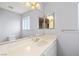 Bathroom featuring a large mirror, vanity, and ample lighting at 2281 Wagon Ave, Pahrump, NV 89048