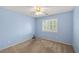 Bedroom with blue walls, carpet, ceiling fan, and shuttered window at 2281 Wagon Ave, Pahrump, NV 89048