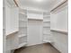 Well-organized walk-in closet with shelving and hanging rods for efficient storage solutions at 2281 Wagon Ave, Pahrump, NV 89048