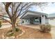 Welcoming covered entrance featuring desert landscaping, with vibrant greenery at 2281 Wagon Ave, Pahrump, NV 89048