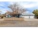 Charming single-story home with a well-manicured front yard, complemented by a three-car garage at 2281 Wagon Ave, Pahrump, NV 89048