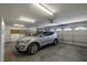 Spacious garage with a modern car, ample lighting, and storage options for convenience at 2281 Wagon Ave, Pahrump, NV 89048