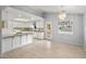Bright kitchen with white cabinets, granite countertops, and stainless steel appliances at 2281 Wagon Ave, Pahrump, NV 89048