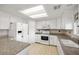 Updated kitchen with white cabinets, granite countertops, and stainless steel appliances at 2281 Wagon Ave, Pahrump, NV 89048