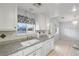 Bright kitchen showcasing granite counters and a picturesque window view at 2281 Wagon Ave, Pahrump, NV 89048