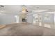 Bright and open living room featuring a fireplace, archway, and ample space for furniture at 2281 Wagon Ave, Pahrump, NV 89048