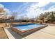 Inviting backyard pool with brick trim and plenty of sunshine perfect for relaxation and fun at 2281 Wagon Ave, Pahrump, NV 89048