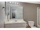 A neutral toned bathroom features vanity, toilet, and shower with glass doors at 231 W Horizon Ridge Pkwy # 426, Henderson, NV 89012