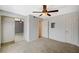 A bright bedroom features a ceiling fan, closet, and a neutral toned carpet at 231 W Horizon Ridge Pkwy # 426, Henderson, NV 89012