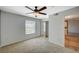 A bright bedroom features a ceiling fan, closet, and window letting in natural light at 231 W Horizon Ridge Pkwy # 426, Henderson, NV 89012