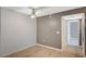 Bedroom with wood-look flooring, a ceiling fan, neutral paint, and a door to the hall at 231 W Horizon Ridge Pkwy # 426, Henderson, NV 89012