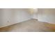 Bedroom featuring neutral carpet, white walls, and two doors with views of hallways and closets at 231 W Horizon Ridge Pkwy # 426, Henderson, NV 89012