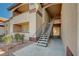 Condominium building exterior with stairwell access and neutral stucco facade and desert landscaping in a sunny environment at 231 W Horizon Ridge Pkwy # 426, Henderson, NV 89012