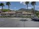 Spacious clubhouse exterior with ample parking, lush landscaping, and mountain views perfect for community gatherings at 231 W Horizon Ridge Pkwy # 426, Henderson, NV 89012