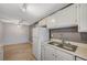 White kitchen with sleek cabinets, modern appliances, and ample counter and cabinet space at 231 W Horizon Ridge Pkwy # 426, Henderson, NV 89012