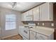 Clean kitchen offers white appliances and cabinets, ample counter space, and vinyl floors at 231 W Horizon Ridge Pkwy # 426, Henderson, NV 89012