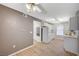 Bright kitchen area features modern lighting, white cabinets and appliances, and vinyl flooring at 231 W Horizon Ridge Pkwy # 426, Henderson, NV 89012