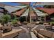 Inviting outdoor lounge area with shaded seating and desert landscaping at 231 W Horizon Ridge Pkwy # 426, Henderson, NV 89012